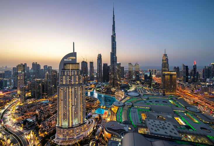 Dubai UAE — Burj Khalifa at night with city skyline